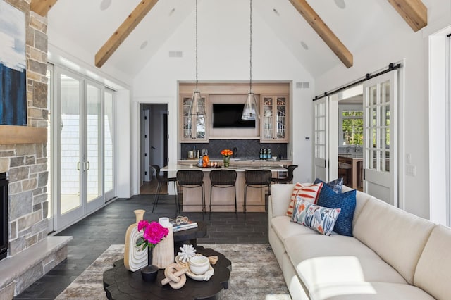 2475 Dunwoody Ave, Orono, MN 55391 - living area featuring beam ceiling, high vaulted ceiling, a barn door, dark wood-style flooring, and french doors