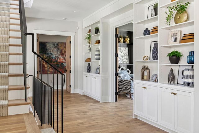 2475 Dunwoody Ave, Orono, MN 55391 - corridor featuring light wood-style flooring, stairs, and built in features