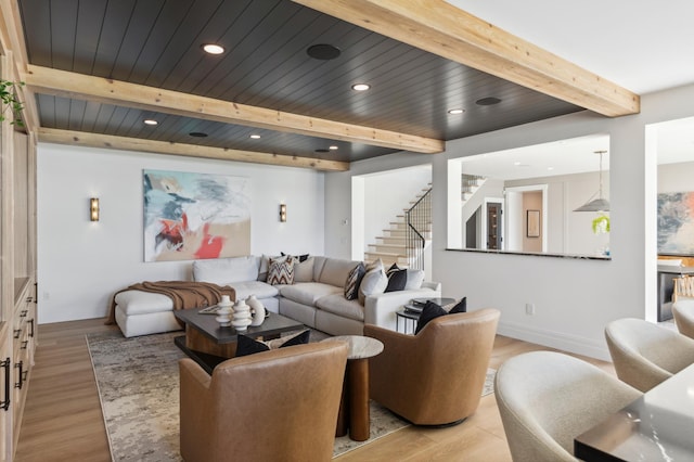 2475 Dunwoody Ave, Orono, MN 55391 - living area featuring beamed ceiling, stairway, light wood-type flooring, baseboards, and recessed lighting