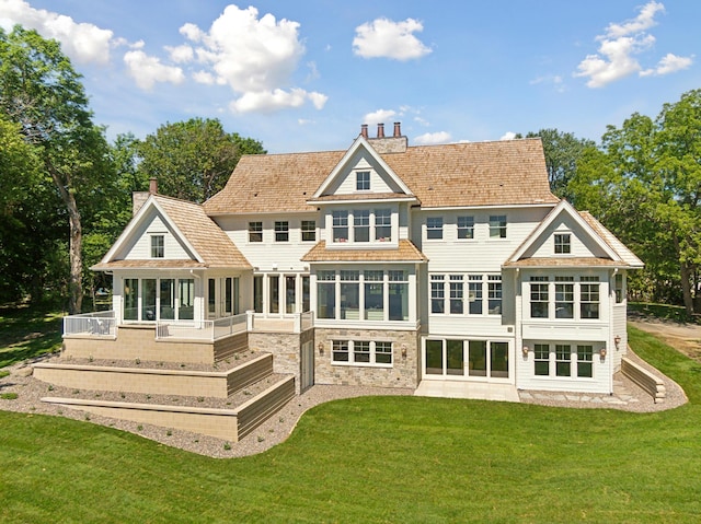2475 Dunwoody Ave, Orono, MN 55391 - rear view of house featuring a sunroom, a chimney, and a yard