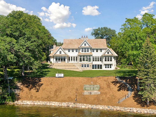 2475 Dunwoody Ave, Orono, MN 55391 - rear view of property featuring a lawn, a water view, and a chimney