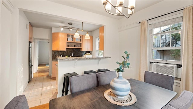 3400 List Pl Unit 1, Minneapolis, MN 55416 - dining room featuring a chandelier, light tile patterned floors, and cooling unit
