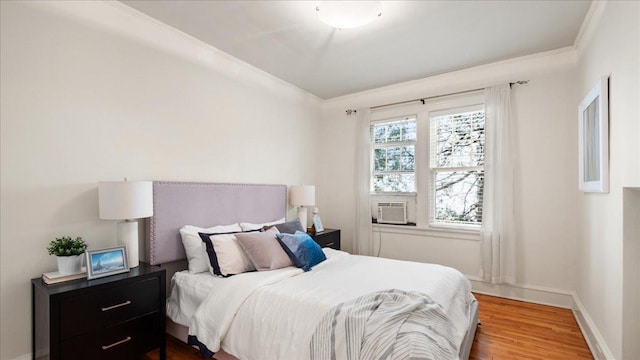 3400 List Pl Unit 1, Minneapolis, MN 55416 - bedroom featuring wood finished floors, ornamental molding, baseboards, and cooling unit