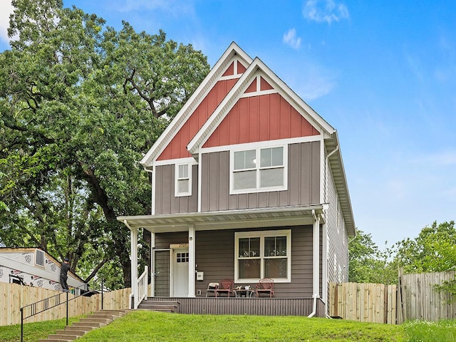 2727 3rd St, Minneapolis, MN 55411 - craftsman house featuring board and batten siding and a porch
