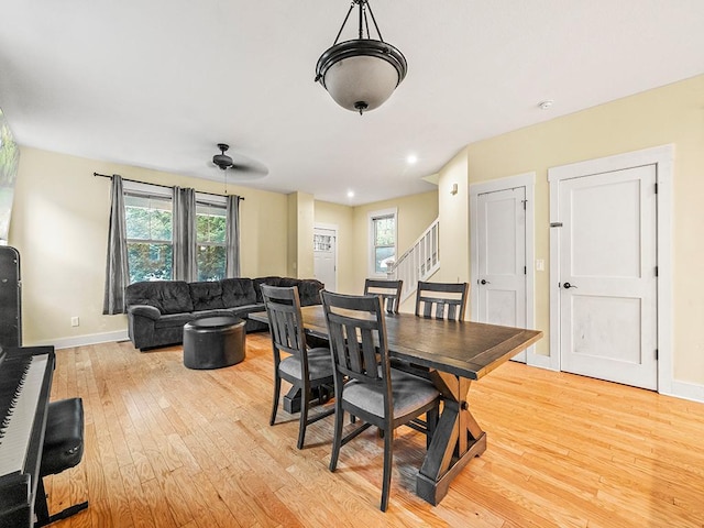 2727 3rd St, Minneapolis, MN 55411 - dining area with light wood-style floors, plenty of natural light, and stairs