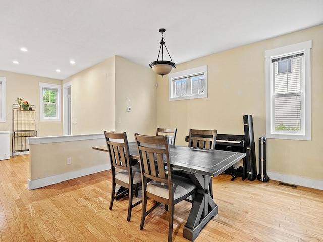 2727 3rd St, Minneapolis, MN 55411 - dining area featuring light wood-style flooring and recessed lighting