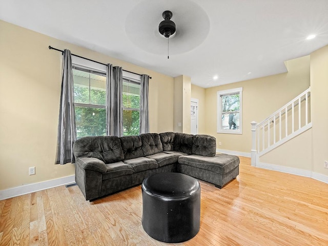2727 3rd St, Minneapolis, MN 55411 - living area featuring wood finished floors, ceiling fan, stairway, and recessed lighting