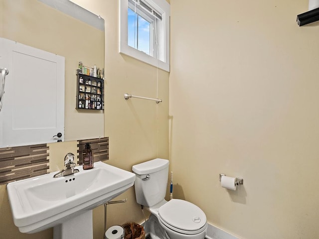 2727 3rd St, Minneapolis, MN 55411 - half bathroom featuring toilet and a sink