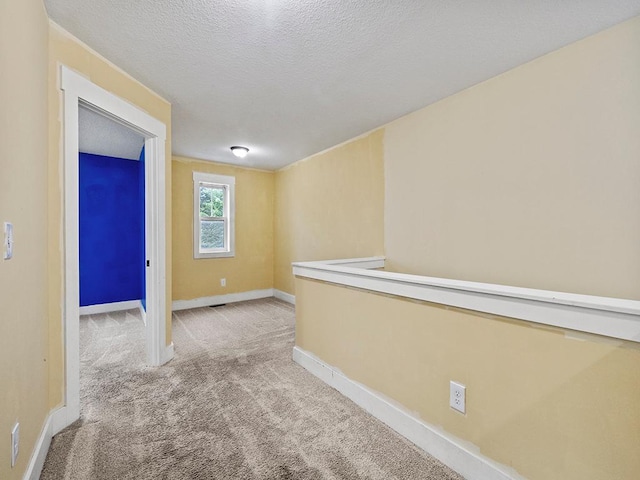 2727 3rd St, Minneapolis, MN 55411 - hallway featuring carpet flooring and a textured ceiling