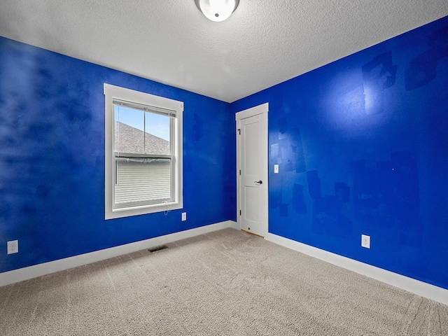 2727 3rd St, Minneapolis, MN 55411 - empty room featuring a textured ceiling and carpet