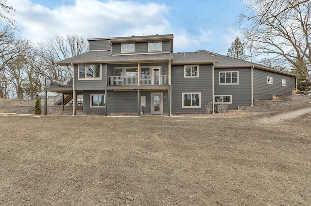 10267 Ferry Point Pl NW, Watab Twp, MN 56367 - rear view of property featuring stairs, roof with shingles, and a deck