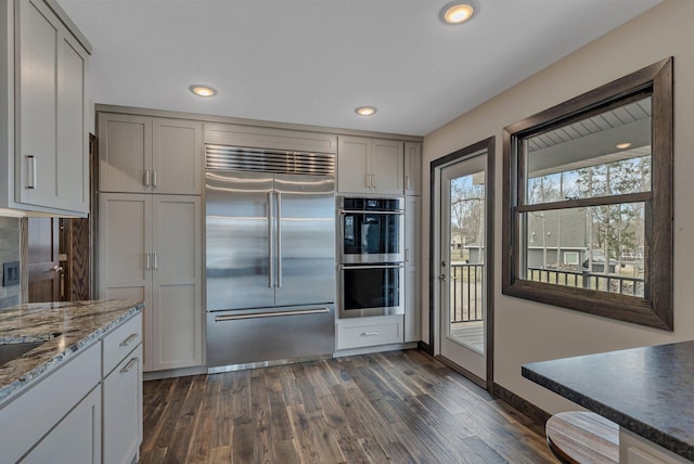 10267 Ferry Point Pl NW, Watab Twp, MN 56367 - kitchen featuring stainless steel appliances, dark wood-type flooring, recessed lighting, stone counters, and gray cabinetry