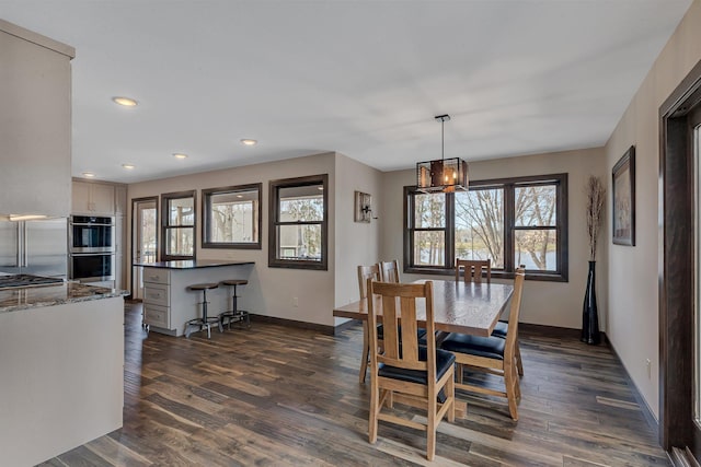 10267 Ferry Point Pl NW, Watab Twp, MN 56367 - dining space with baseboards, dark wood-style floors, recessed lighting, and a chandelier