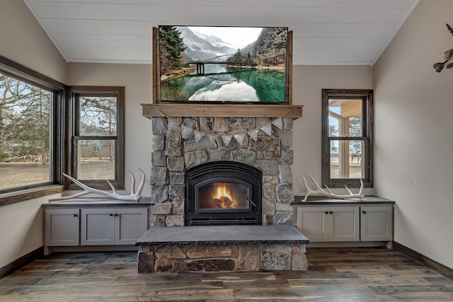 10267 Ferry Point Pl NW, Watab Twp, MN 56367 - detailed view of wood finished floors, baseboards, and a fireplace