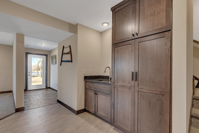 10267 Ferry Point Pl NW, Watab Twp, MN 56367 - indoor wet bar featuring baseboards and light tile patterned floors