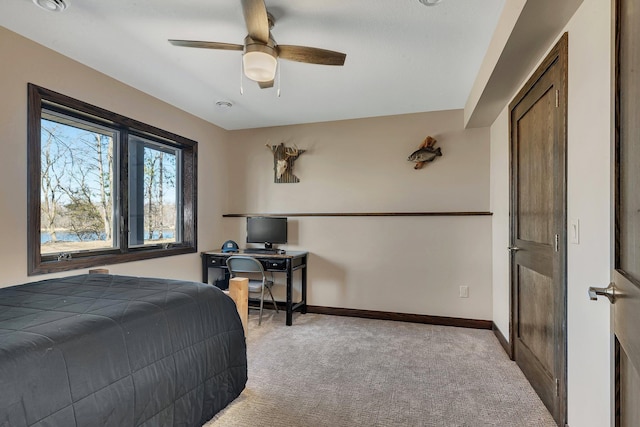 10267 Ferry Point Pl NW, Watab Twp, MN 56367 - bedroom with light carpet, baseboards, and a ceiling fan