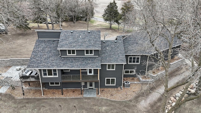 10267 Ferry Point Pl NW, Watab Twp, MN 56367 - rear view of house featuring roof with shingles and central AC unit