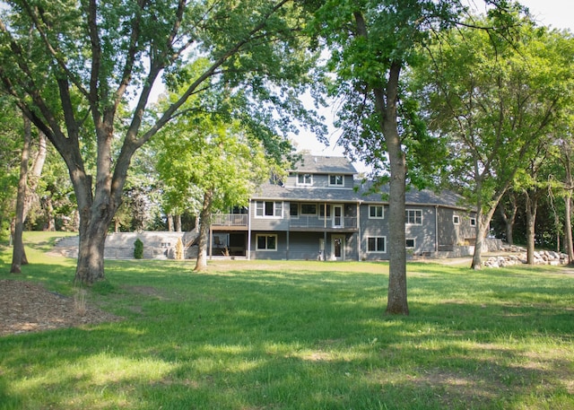 10267 Ferry Point Pl NW, Watab Twp, MN 56367 - back of property with a deck and a lawn