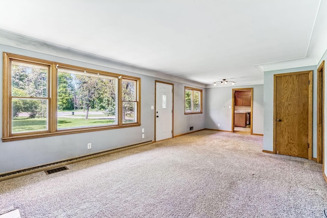 20257 Viking Blvd NE, Wyoming, MN 55092 - unfurnished living room with light carpet and baseboards