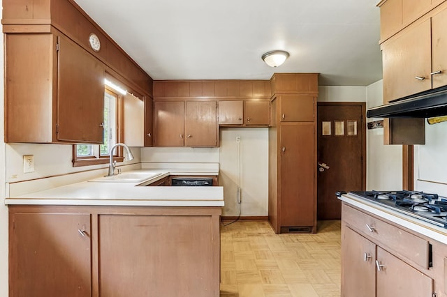 20257 Viking Blvd NE, Wyoming, MN 55092 - kitchen with a sink, under cabinet range hood, a peninsula, light countertops, and stainless steel gas cooktop