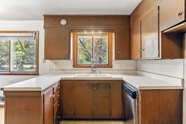 20257 Viking Blvd NE, Wyoming, MN 55092 - kitchen featuring stainless steel dishwasher, a sink, a peninsula, light countertops, and plenty of natural light