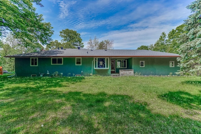 20257 Viking Blvd NE, Wyoming, MN 55092 - rear view of property featuring stucco siding and a lawn