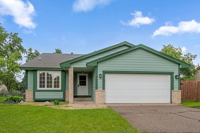 11813 Kerry St NW, Coon Rapids, MN 55433 - ranch-style home featuring brick siding, driveway, and a garage