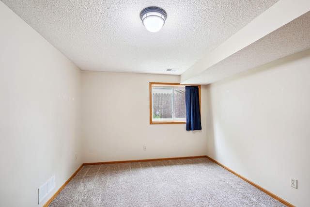 11813 Kerry St NW, Coon Rapids, MN 55433 - carpeted spare room featuring a textured ceiling and baseboards