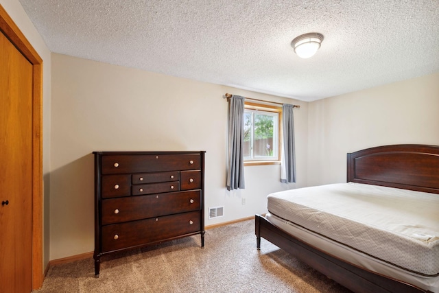 11813 Kerry St NW, Coon Rapids, MN 55433 - carpeted bedroom featuring baseboards and a textured ceiling