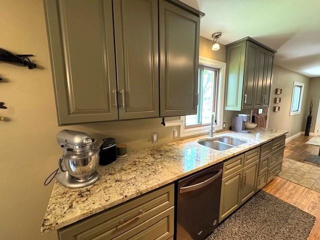 208 Mason Ave, Verndale, MN 56481 - kitchen featuring stainless steel dishwasher, a sink, plenty of natural light, and light wood finished floors