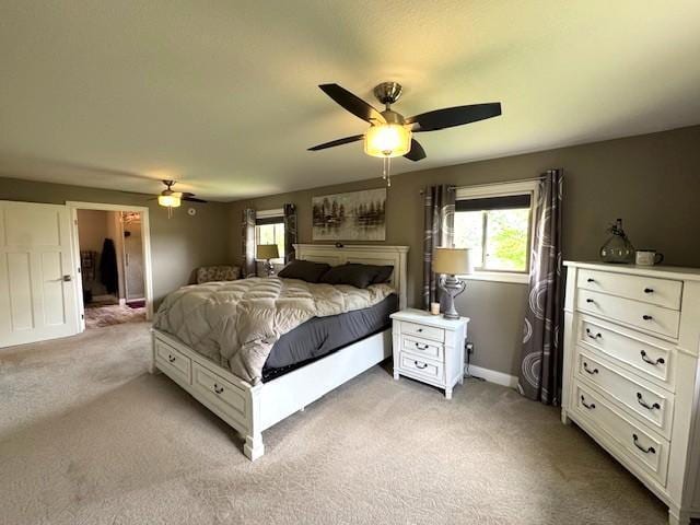 208 Mason Ave, Verndale, MN 56481 - bedroom with multiple windows, light carpet, and a ceiling fan