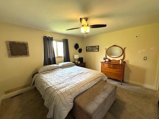 208 Mason Ave, Verndale, MN 56481 - bedroom featuring baseboards, carpet, and ceiling fan