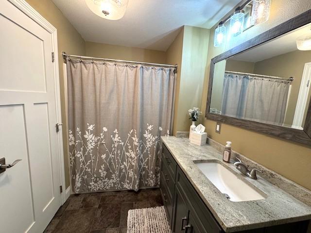 208 Mason Ave, Verndale, MN 56481 - bathroom featuring vanity and a shower with shower curtain