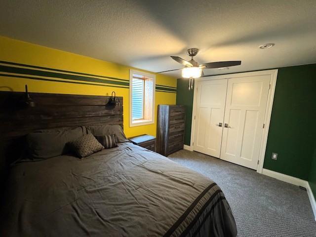 208 Mason Ave, Verndale, MN 56481 - carpeted bedroom featuring baseboards, a ceiling fan, and a closet