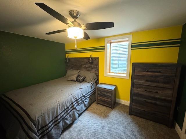 208 Mason Ave, Verndale, MN 56481 - carpeted bedroom with ceiling fan and baseboards