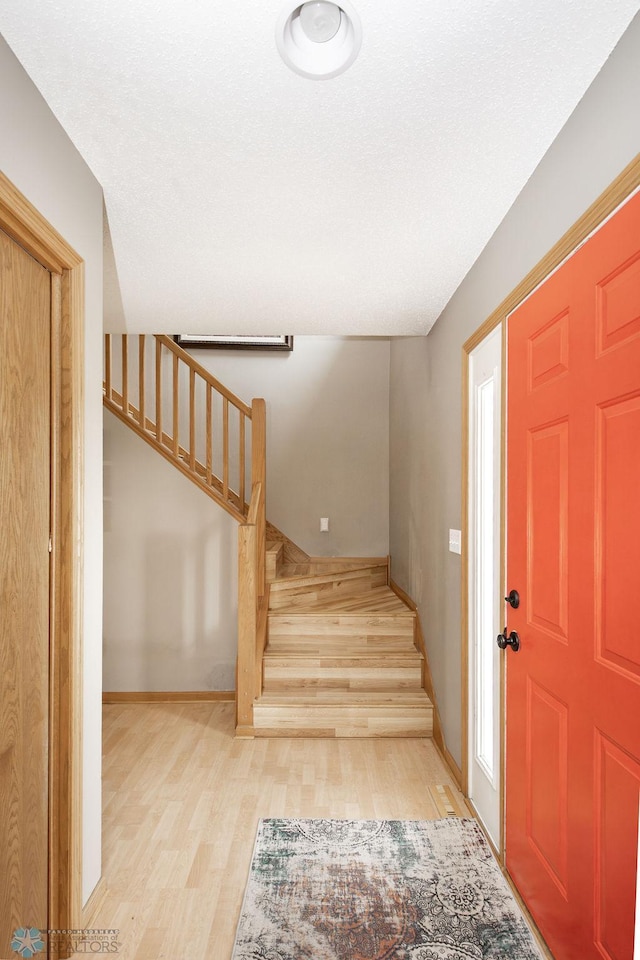 1727 33rd St S, Moorhead, MN 56560 - entryway featuring stairway, light wood-type flooring, and baseboards