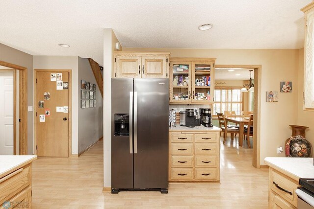 1727 33rd St S, Moorhead, MN 56560 - kitchen featuring stainless steel refrigerator with ice dispenser, light wood-type flooring, light countertops, light brown cabinets, and recessed lighting