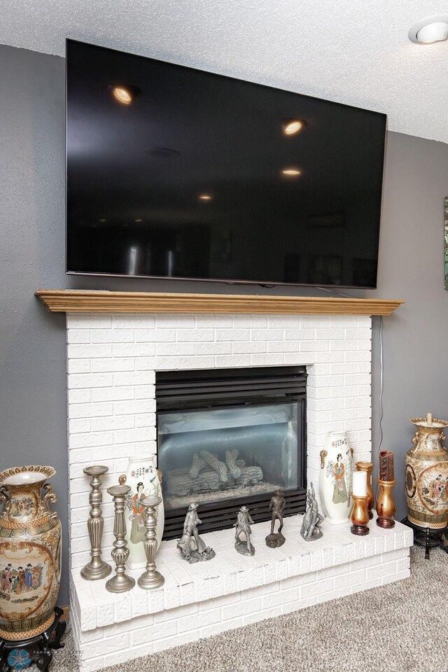 1727 33rd St S, Moorhead, MN 56560 - detailed view of a fireplace, carpet, and a textured ceiling