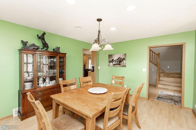 1727 33rd St S, Moorhead, MN 56560 - dining room featuring light wood-style flooring, baseboards, recessed lighting, and stairs