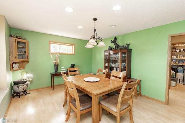 1727 33rd St S, Moorhead, MN 56560 - dining room featuring light wood-style flooring, a chandelier, recessed lighting, and baseboards