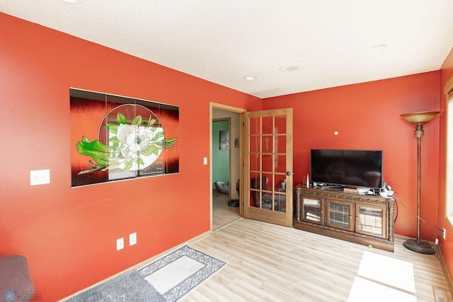 1727 33rd St S, Moorhead, MN 56560 - living area with wood finished floors, baseboards, french doors, and recessed lighting