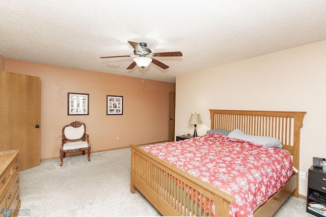 1727 33rd St S, Moorhead, MN 56560 - bedroom featuring light colored carpet, ceiling fan, a textured ceiling, and baseboards