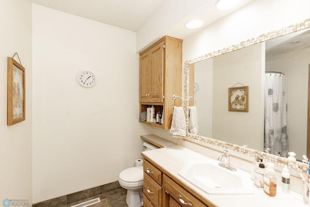 1727 33rd St S, Moorhead, MN 56560 - bathroom with toilet, vanity, and a shower with shower curtain