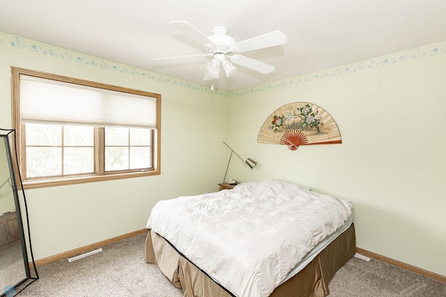 1727 33rd St S, Moorhead, MN 56560 - carpeted bedroom featuring baseboards and ceiling fan