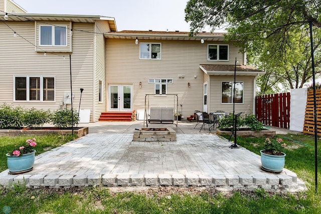 1727 33rd St S, Moorhead, MN 56560 - rear view of house with a patio, french doors, an outdoor fire pit, and entry steps