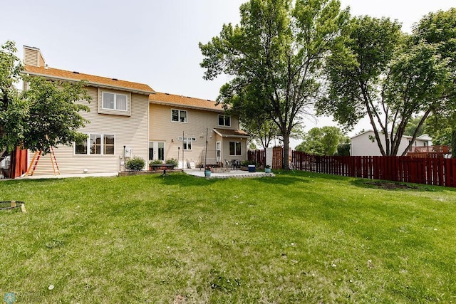 1727 33rd St S, Moorhead, MN 56560 - back of house with a patio area and a chimney