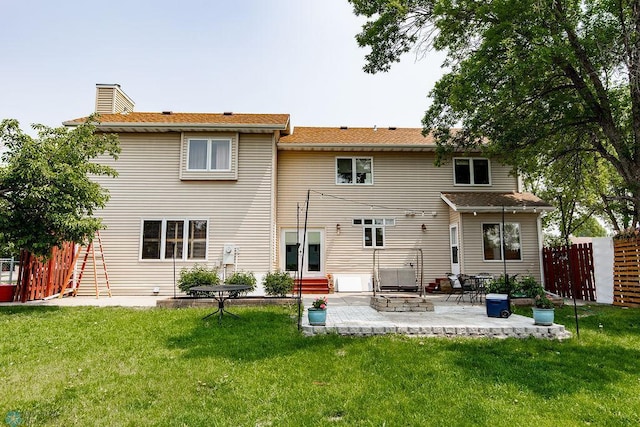 1727 33rd St S, Moorhead, MN 56560 - rear view of house with a patio, a chimney, and entry steps