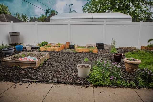 210 6th St, Morris, MN 56267 - fenced backyard featuring a garden