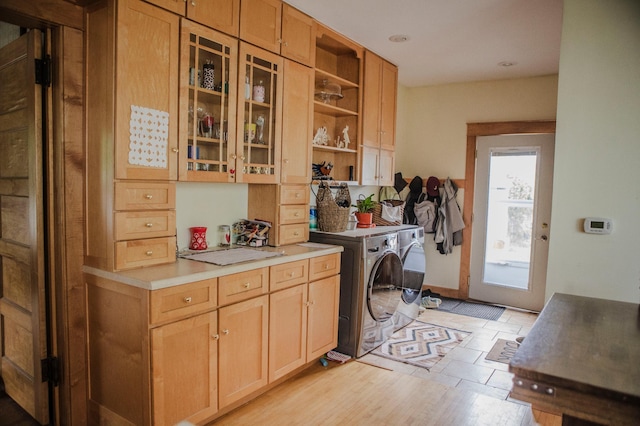 210 6th St, Morris, MN 56267 - laundry room featuring cabinet space, independent washer and dryer, and light wood-style flooring
