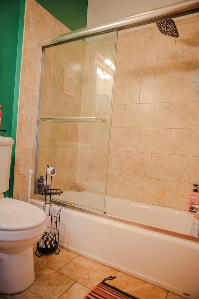 210 6th St, Morris, MN 56267 - bathroom with toilet, enclosed tub / shower combo, and tile patterned floors